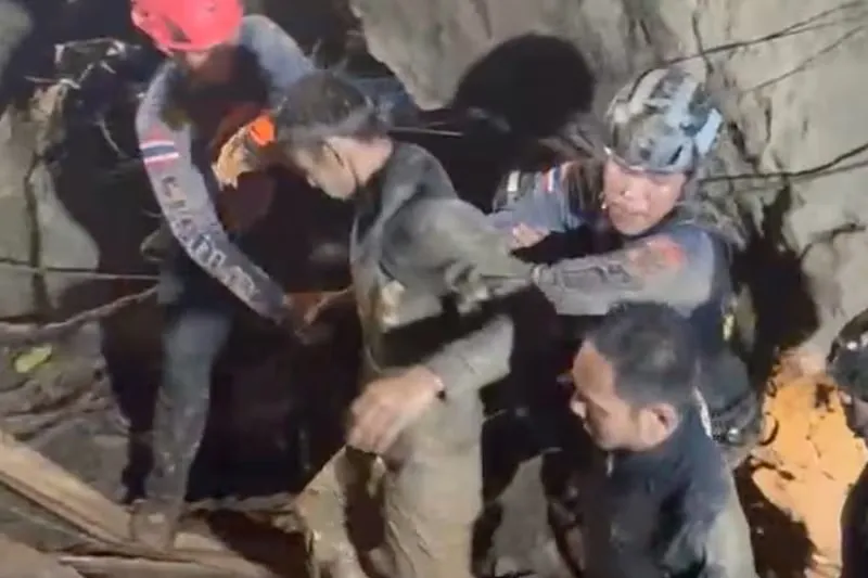 Rescuers evacuate first of 5 villagers found trapped in cave in Laos; 2 still missing